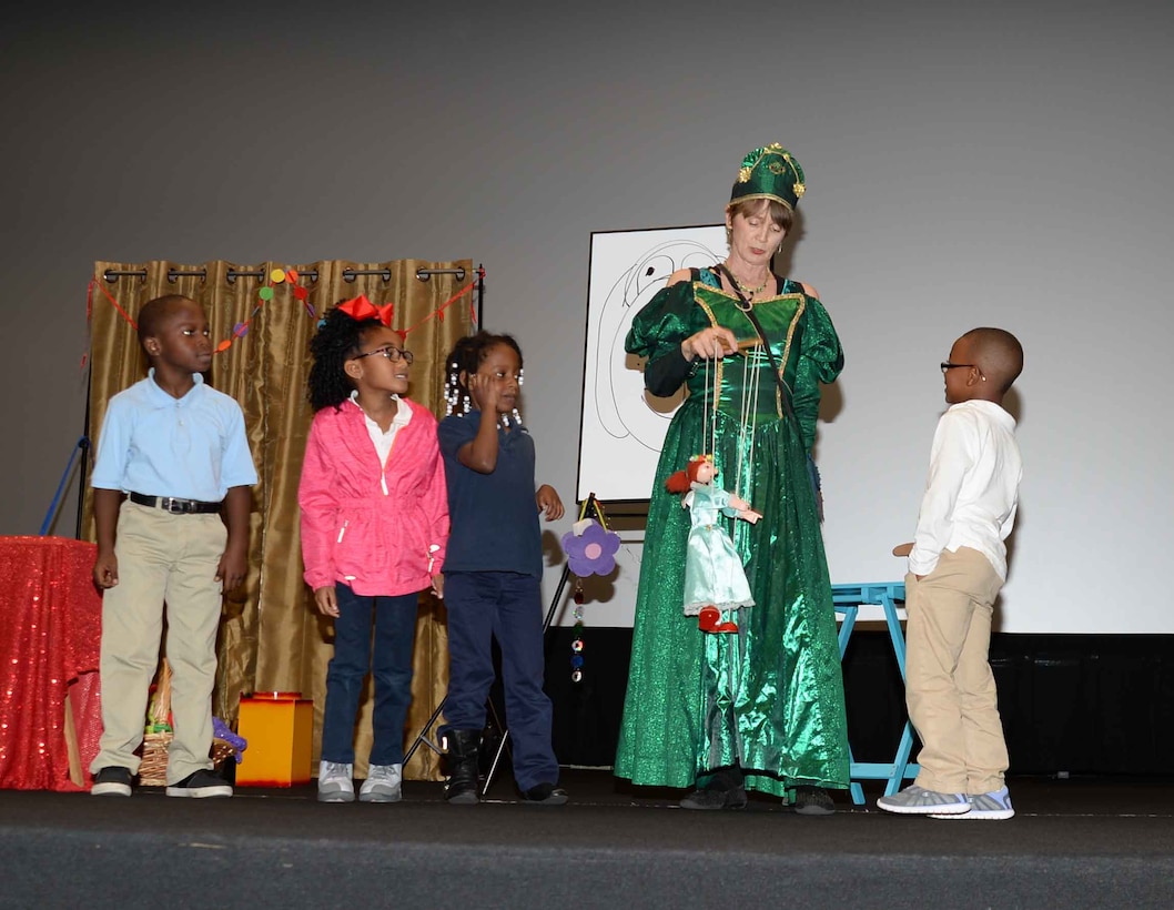 Queen Emeralda, professional storyteller, leaves her home in Fairyland to bring “laughter and fun” to Marine Corps Logistics Base Albany’s young audience, who filled the Base Theater, April 25. The event, which was hosted in celebration of the Month of the Military Child, was also held to bring awareness to and in observance of the 2017 Child Abuse and Neglect Prevention Month. Three-year old students from MCLB Albany’s Child Development Center as well as kindergarteners from International Studies Elementary Charter School, Albany, Ga., attended the activities.