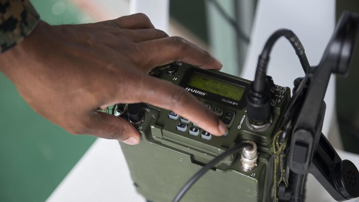 U.S. Marine Staff Sgt. Alexander Davis adjusts a AN/PRC-117G radio during Balikatan 2017 at Camp Lapulapu, Cebu, April 25, 2017. Balikatan is an annual U.S.-Philippine military bilateral exercise focused on a variety of missions, including humanitarian assistance and disaster relief, and counterterrorism. (U.S. Air Force photo by Senior Airman Corey Pettis)