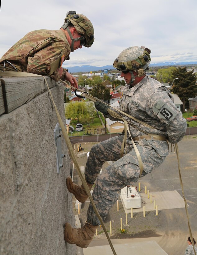 Army Sgt. Anthony Barba lowers during a vertical access training exercise at Yakima Fire Station 95, Yakima, Wash., April 25, 2017. Army photo by Sgt. Kalie Jones