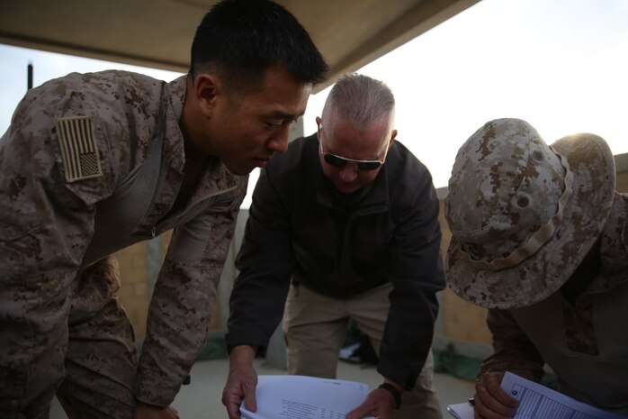 U.S. Marine Maj. Yongjin Chang, the officer in charge of 4th Air Naval Gunfire Liaison Company, Special Purpose Marine Air-Ground Task Force-Crisis Response-Central Command,  discusses range boundaries and target sets during a  close air support exercise while forward deployed to the Middle East, Dec. 14, 2016. 4th ANGLICO, M Detachment, an all Reserve unit based out of West Palm Beach, Florida, is currently forward deployed in the Middle East with Special Purpose Marine Air-Ground Task Force-Crisis Response-Central Command. M Detachment is comprised of forward observers, radio operators, joint fires observers, artillery officers and a corpsman, all of which play an important role in the SPMAGTF’s crisis response mission.   (U.S. Marine Corps photo by Cpl. Shellie Hall)
