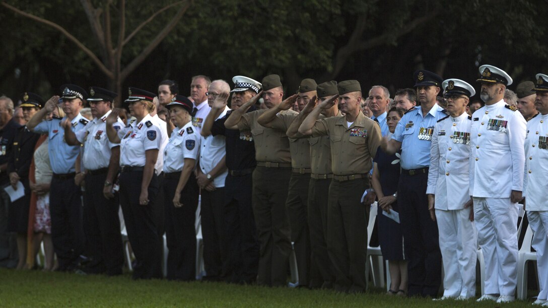 Service members with the Australian Defence Force and the United States Marine Corps salute Last Post, in Darwin, Australia, April 25, 2017. ANZAC Day commemorates the anniversary of the landing of the Australian New Zealand Army Corps on the shores of Gallipoli during World War I and has become a holiday in Australia and New Zealand.