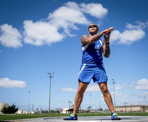 Rafael Morfin, a Warrior Games athlete, begins his discus rotation during a track and field session at the Air Force team’s training camp at Eglin Air Force Base, Fla., April 26. The base-hosted, week-long Warrior Games training camp is the last team practice session before the yearly competition in June. (U.S. Air Force photo/Samuel King Jr.)