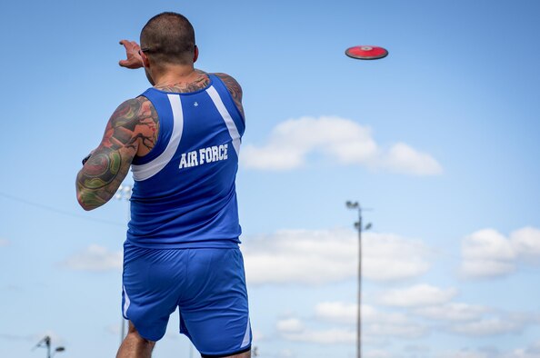 Rafael Morfin, a Warrior Games athlete, releases his disc rotation during a track and field session at the Air Force team’s training camp at Eglin Air Force Base, Fla., April 26. The base-hosted, week-long Warrior Games training camp is the last team practice session before the yearly competition in June. (U.S. Air Force photo/Samuel King Jr.)