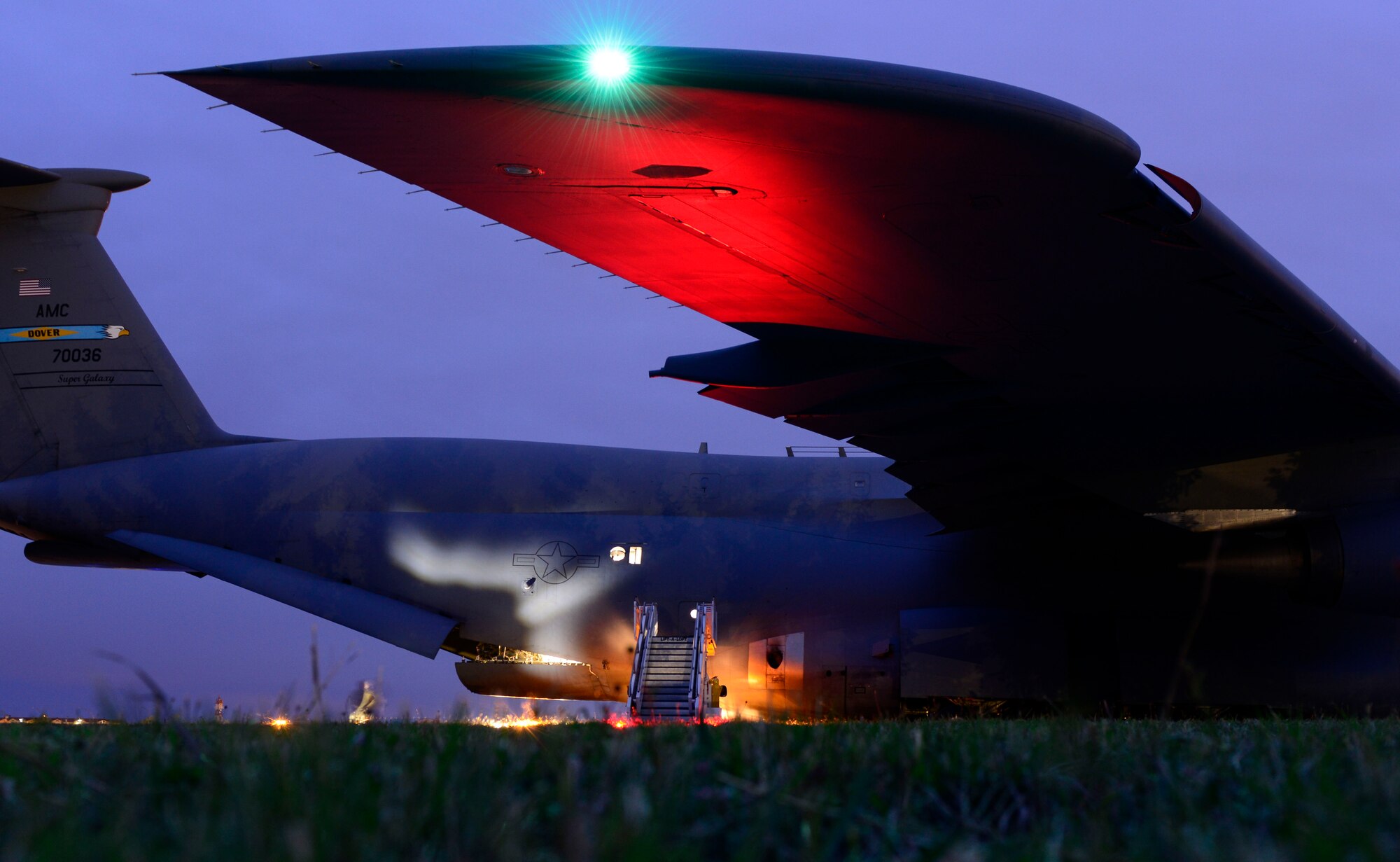 A C-5 Galaxy sits on the runway at Aviano Air Base, Italy, April 19, 2017. The 31st Logistics Readiness Squadron prepared approximately 60 Airmen from the 555th Fighter Squadrons to depart on the C-5 for Bagram Airfield, Afghanistan. (U.S. Air Force photo by Airman 1st Class Ryan Brooks)