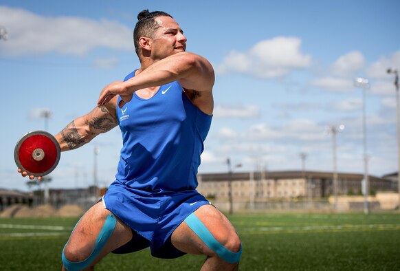 Staff Sgt. Vince Cavazos, a Warrior Games athlete, begins his discus rotation during a track and field session at the Air Force team’s training camp at Eglin Air Force Base, Fla., April 26. The base-hosted, week-long Warrior Games training camp is the last team practice session before the yearly competition in June. (U.S. Air Force photo/Samuel King Jr.)
