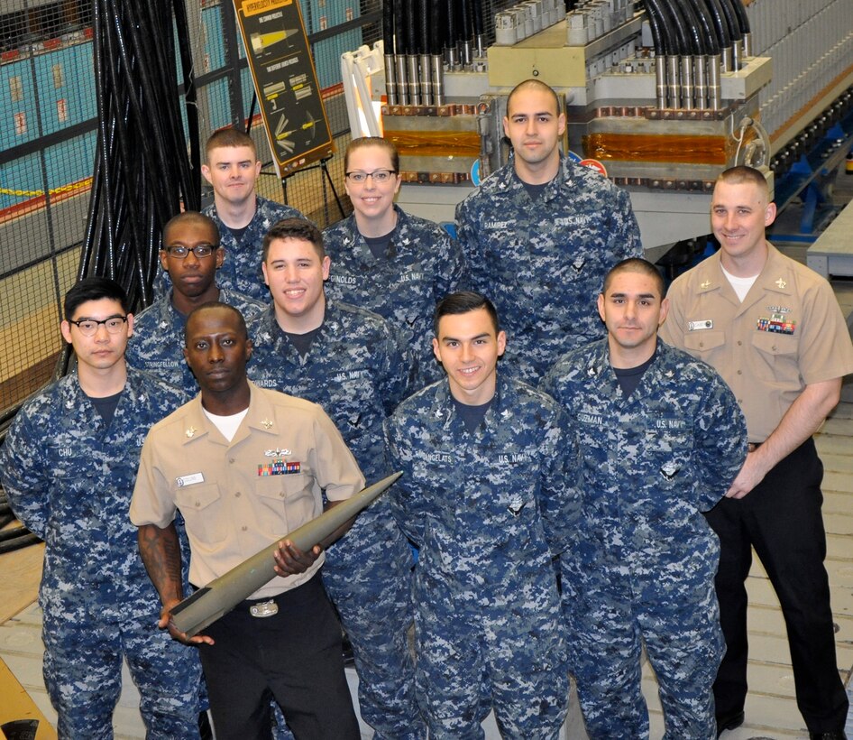 DAHLGREN, Va. (April 14, 2017) - Aegis Training and Readiness Center Sailors are pictured in front of the electromagnetic railgun prototype launcher at Naval Surface Warfare Center Dahlgren Division. Navy scientists and engineers briefed the Sailors - currently taking Aegis Combat System courses at ATRC - on electromagnetic launchers, hypervelocity projectiles, and directed energy weapons.