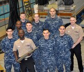 DAHLGREN, Va. (April 14, 2017) - Aegis Training and Readiness Center Sailors are pictured in front of the electromagnetic railgun prototype launcher at Naval Surface Warfare Center Dahlgren Division. Navy scientists and engineers briefed the Sailors - currently taking Aegis Combat System courses at ATRC - on electromagnetic launchers, hypervelocity projectiles, and directed energy weapons.