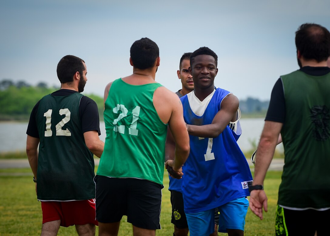 U.S. Air Force and French air force Airmen shake hands at the end of the ATLANTIC TRIDENT 17 soccer tournament, at Joint Base Langley-Eustis, Va., April 22, 2017. The Airmen were given the opportunity to socialize with each other while putting their athleticism on display during the tournament. (U.S. Air Force photo/Staff Sgt. Areca T. Bell)