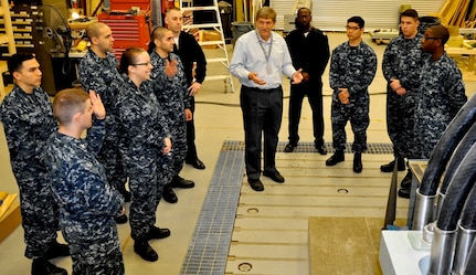 DAHLGREN, Va. (April 14, 2017) - Navy Electromagnetic Railgun Lead Systems Engineer Chester Petry explains railgun components and technology to Sailors from Aegis Training and Readiness Center (ATRC). The Sailors are taking ATRC courses that provide them with the knowledge, ability, and skill to operate and maintain the Aegis Combat System.