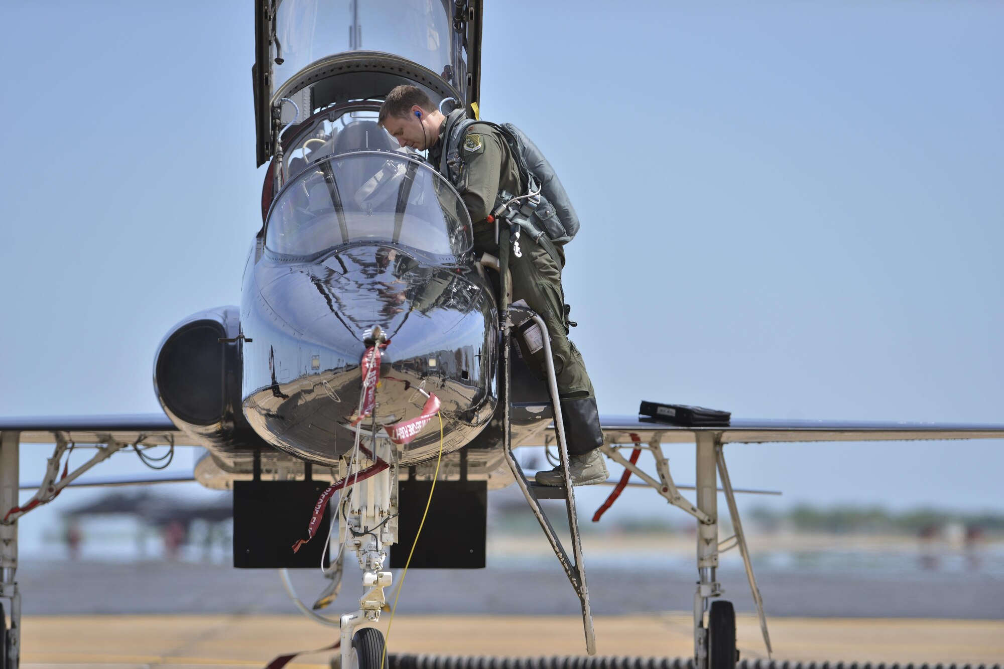 U.S. Air Force Maj. Nathaniel Lightfoot, 71st Fighter Training Squadron aggressor pilot, deplanes after a combat training mission during ATLANTICTRIDENT 17 at Joint Base Langley-Eustis, Va., April 18, 2016. The aggressors are the aerial adversaries of the exercise, which focuses on harnessing fifth-generation capabilities with fourth generation fighters from partnering nations. (U.S. Air Force photo/Staff Sgt. Natasha Stannard)