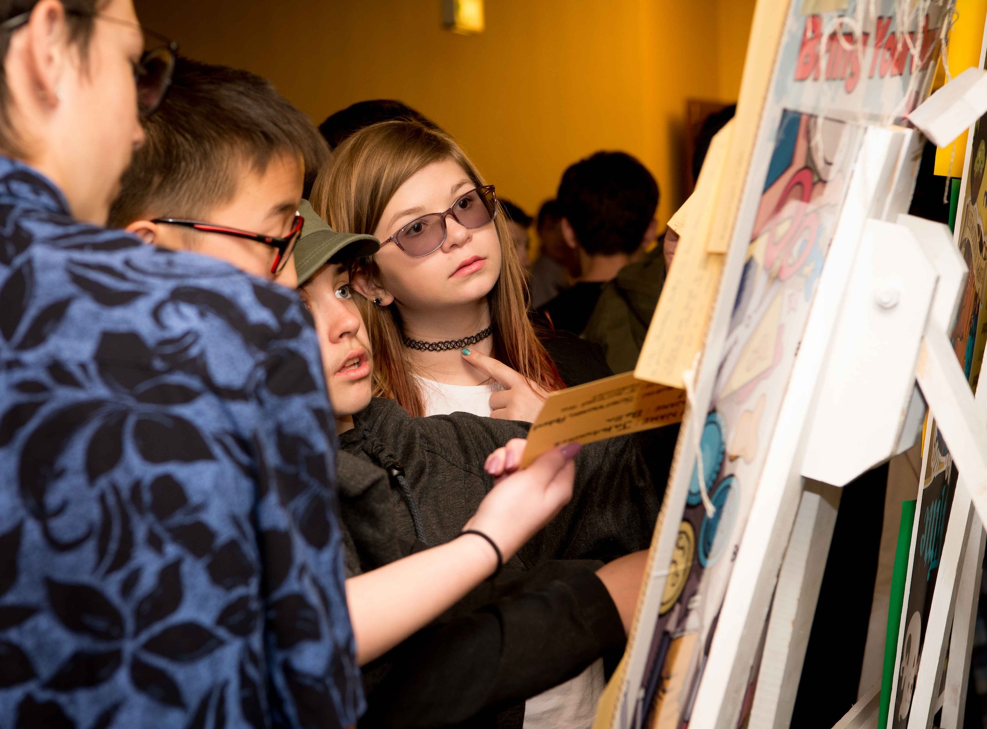 Children from Ramstein Air Base schools observe displays created in honor of Holocaust victims at Ramstein Air Base, Germany, April 25, 2017. The 86th Airlift Wing’s Holocaust Remembrance honors all who were persecuted in the Holocaust as well as anyone who has been affected by the tragedy, including rescuers and U.S. soldiers who risked their lives during the liberation. (U.S. Air Force photo by Senior Airman Elizabeth Baker)