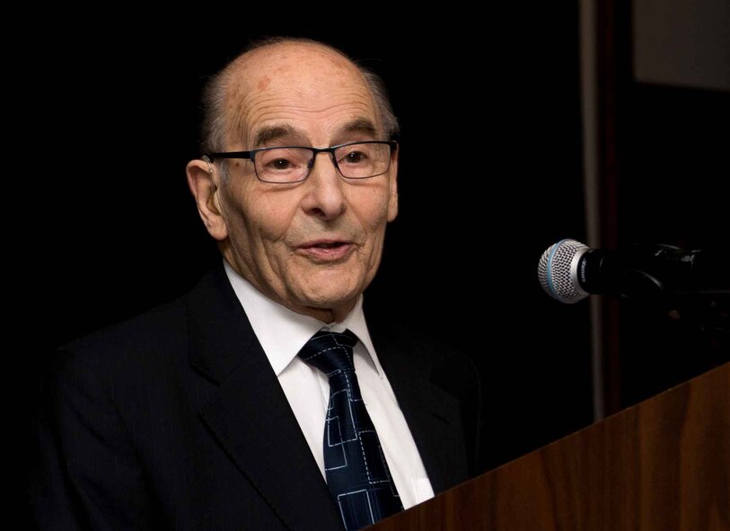 Bob Kirk, honored guest at the 86th Airlift Wing’s Holocaust Remembrance, tells stories from his life to audiences at Ramstein Air Base, Germany, April 25, 2017. As a Jewish individual living in Germany before World War II, Kirk suffered from persecution and escaped to Great Britain via the Kindertranport. Kirk and his wife, Ann, shared their stories to raise awareness of the Holocaust and honor those who were persecuted. (U.S. Air Force photo by Senior Airman Elizabeth Baker)