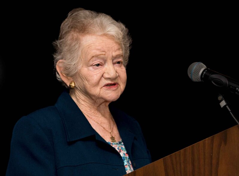 Ann Kirk, honored guest at the 86th Airlift Wings Holocaust Remembrance, tells stories of her experience with the Kinderstansport to audiences at Ramstein Air Base, Germany, April 25, 2017. The Kindertransport was a series of rescue efforts which brought thousands of refugee Jewish children like Kirk to Great Britain from Nazi Germany between 1938 and 1940. Kirk and her husband, Bob, shared their stories to raise awareness of the Holocaust and honor those who were persecuted. (U.S. Air Force photo by Senior Airman Elizabeth Baker)