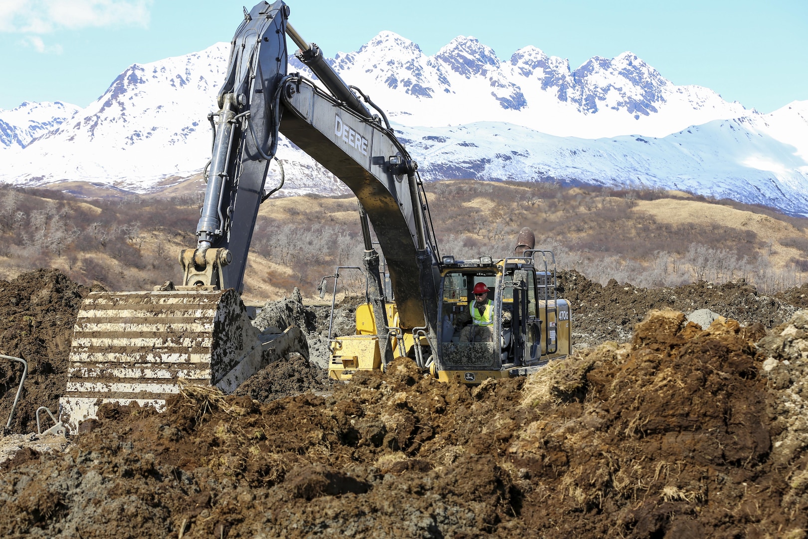 Arizona National Guard Spc. Aaron Tellez, a motor vehicle operator with the 259th Engineer Platoon, operates an excavator during a runway extension project at Innovative Readiness Training Old Harbor, Alaska, April 19, 2017. The project will extend the existing Old Harbor runway by 2,700 feet, which will allow larger aircraft to land in Old Harbor. 