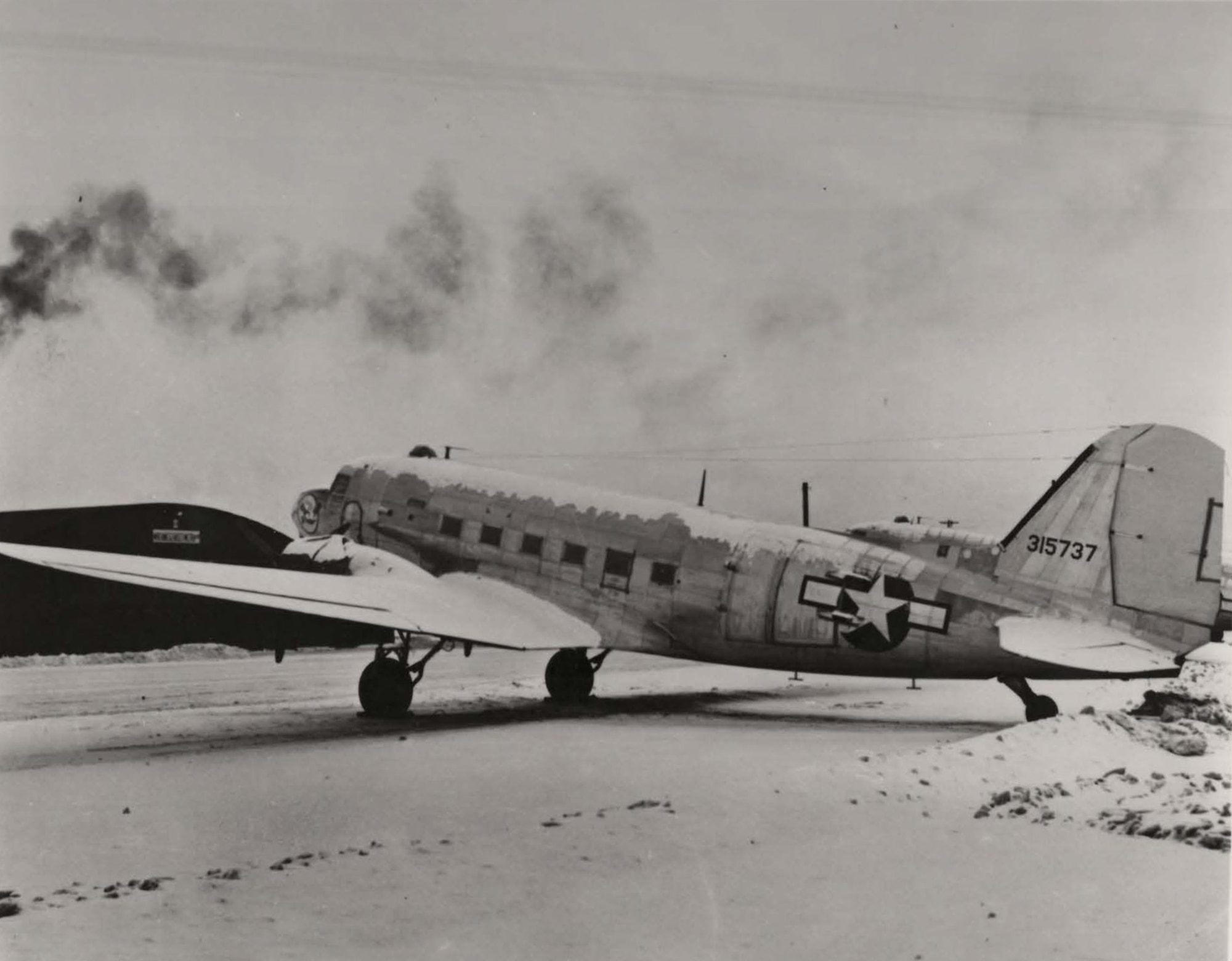 A U.S. Air Force C-47 Skytrain sits on Elmendorf Field at Elmendorf Air Force Base, Alaska. This aircraft was assigned to the 54th Troop Carrier Squadron and was responsible for flying from forward bases into frontline airfields, dropping supplies to infantry troops engaged in battle and dropping paratroopers onto the battlefield. (Courtesy photo/released)