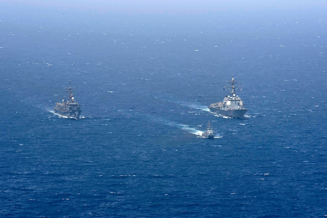 170426-N-NB178-159 RED SEA (April 26, 2017) The guided-missile destroyer USS Truxtun (DDG 103), right, steams in formation with Egyptian frigate ENS Taba (F 916), left, and fast moving boat FMB 21st October, center, during a photo exercise (PHOTOEX) to conclude Exercise Eagle Salute 17. Eagle Salute/Eagle Response 17 is a multilateral exercise with Egypt, Saudi Arabia and United Arab Emirates to enhance mutual capabilities in maritime security operations. Truxtun is deployed to the U.S. 5th Fleet area of operations in support of maritime security operations designed to reassure allies and partners and preserve the freedom of navigation and the free flow of commerce in the region. (U.S. Navy photo by Mass Communication Specialist 2nd Class Tyrell K. Morris)