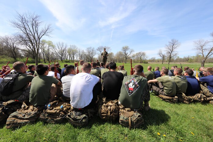 Marine Corps Capt. Adam Crise, an officer selection officer with Officer Selection Station Iowa City, Recruiting Station Des Moines, speaks to a group of Marine Corp officer candidates aboard Camp Dodge, Johnston, Iowa, April 22, 2017. The Officer Candidate School preparation weekend was held to enhance readiness through challenging and realistic training with a focus on basic Marine Corps knowledge and skills. (U.S. Marine Corps photo by Cpl. Zachery B. Martin)