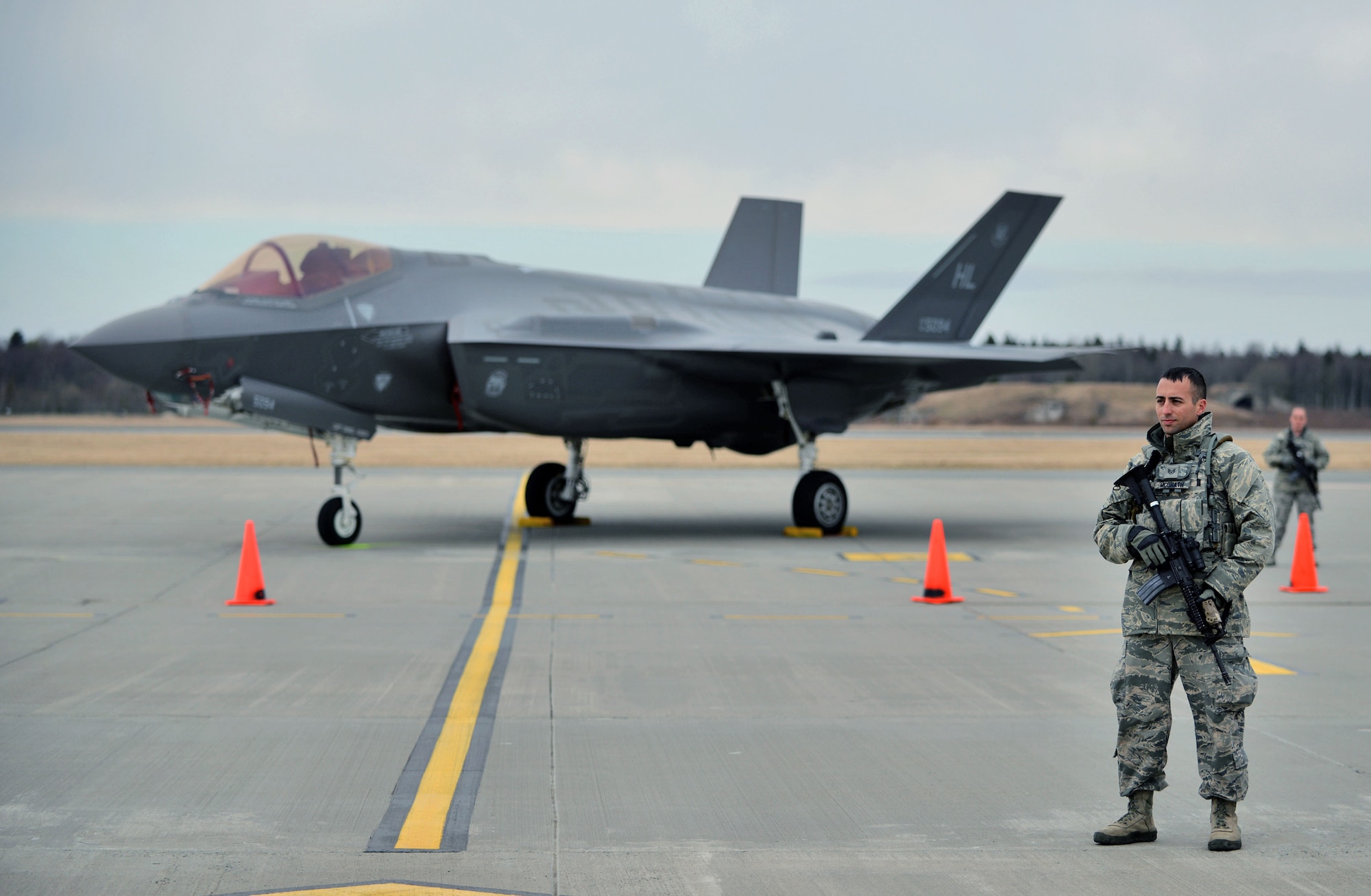 Staff Sgt. Joseph McGrath, 419th Security Forces Squadron, stands beside an F-35A Lightning II at Amari Air Base, Estonia. SFS personnel provided security this week for the aircraft’s arrival in the country, which is one of several stops for the F-35 during its first European deployment. Eight jets and about 250 personnel from the Air Force Reserve 419th Fighter Wing and active duty 388th FW at Hill Air Force Base, Utah, are in Europe for several weeks and will travel to multiple NATO bases in an effort to maximize training opportunities and demonstrate U.S. support to NATO. (U.S. Air Force photo/Micah Garbarino)