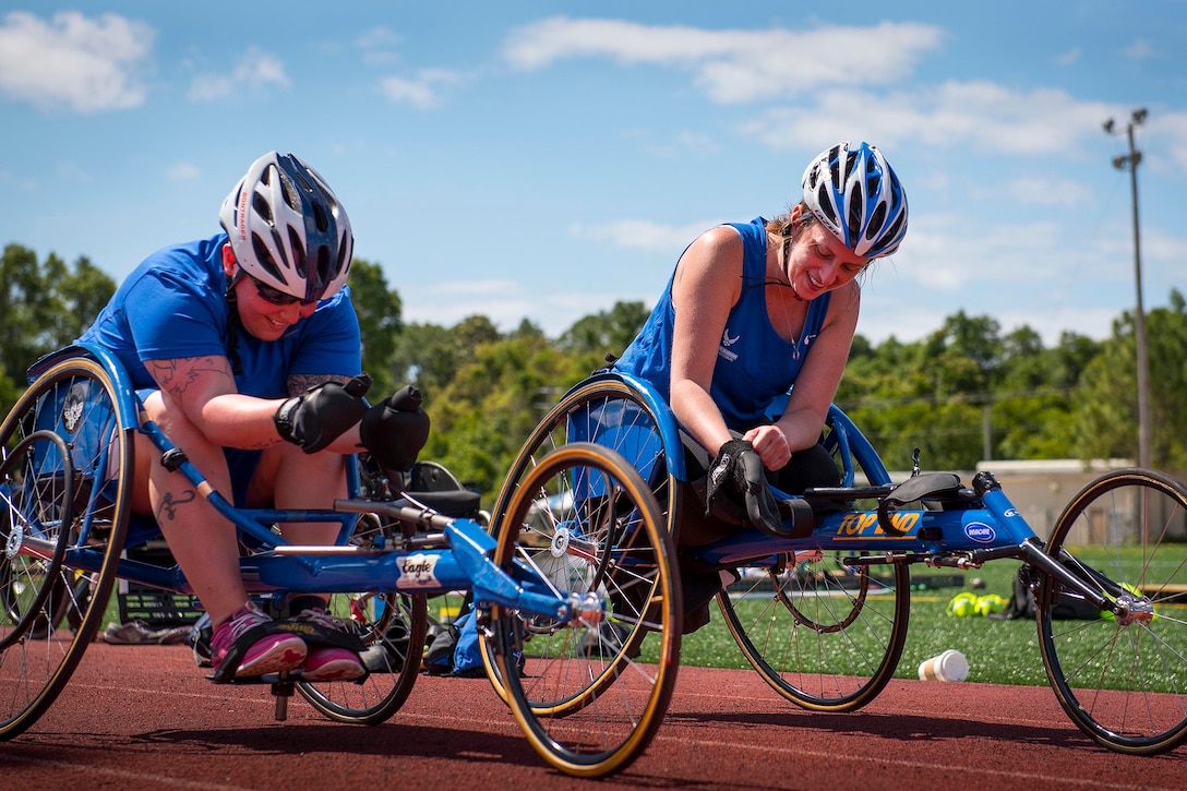 Jamie Biviano and Melinda Smith, Air Force Warrior Games team members, prepare to race during a practice session at the team’s training camp at Eglin Air Force Base, Fla., April 26. Air Force photo by Samuel King Jr.