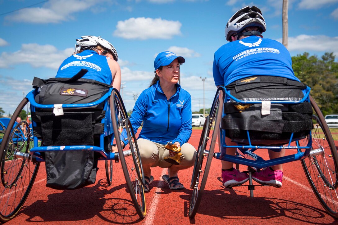 Warrior Games coach Teresa Skinner talks with athletes at track and field practice during the Air Force team’s Warrior Games training camp at Eglin Air Force Base, Fla., April 26, 2017. The weeklong camp is the last team practice session before the yearly competition in June. Air Force photo by Samuel King Jr.