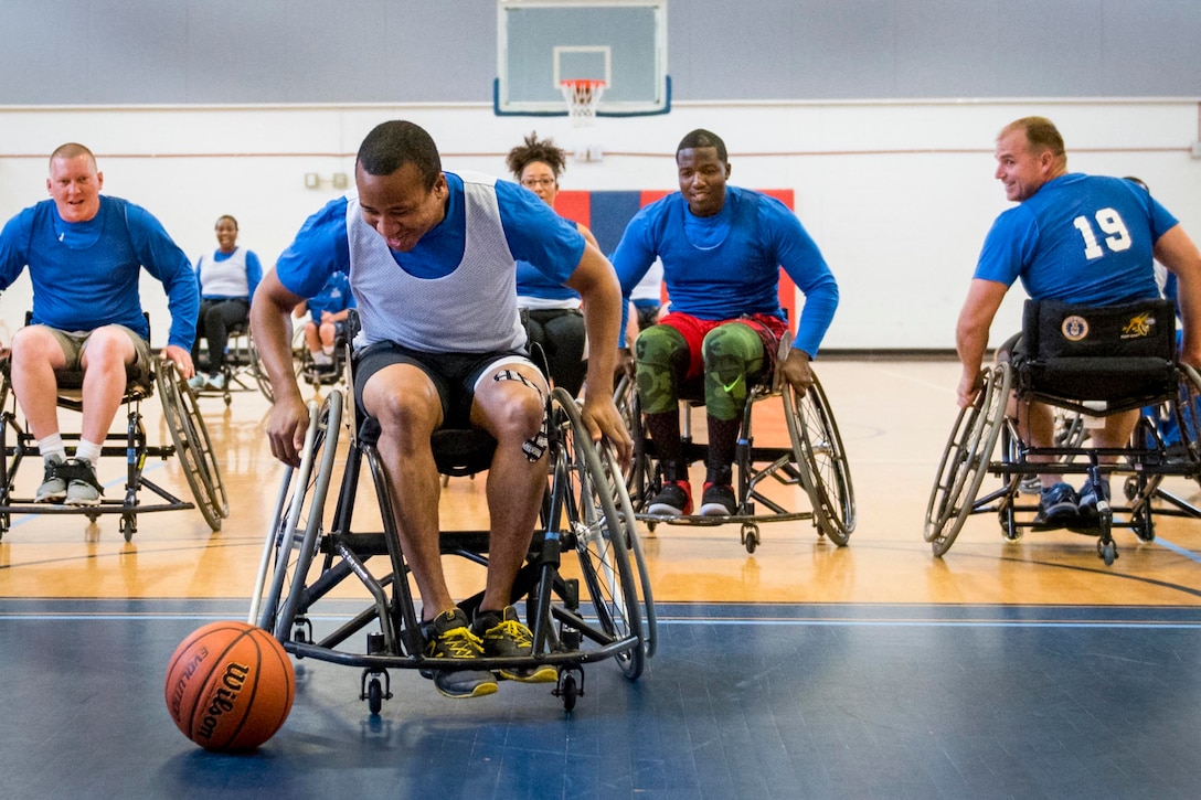 An airman attending a Warrior CARE adaptive sports camp races to catch up to a loose ball at Eglin Air Force Base, Fla., April 26, 2017. Air Force photo by Samuel King Jr.