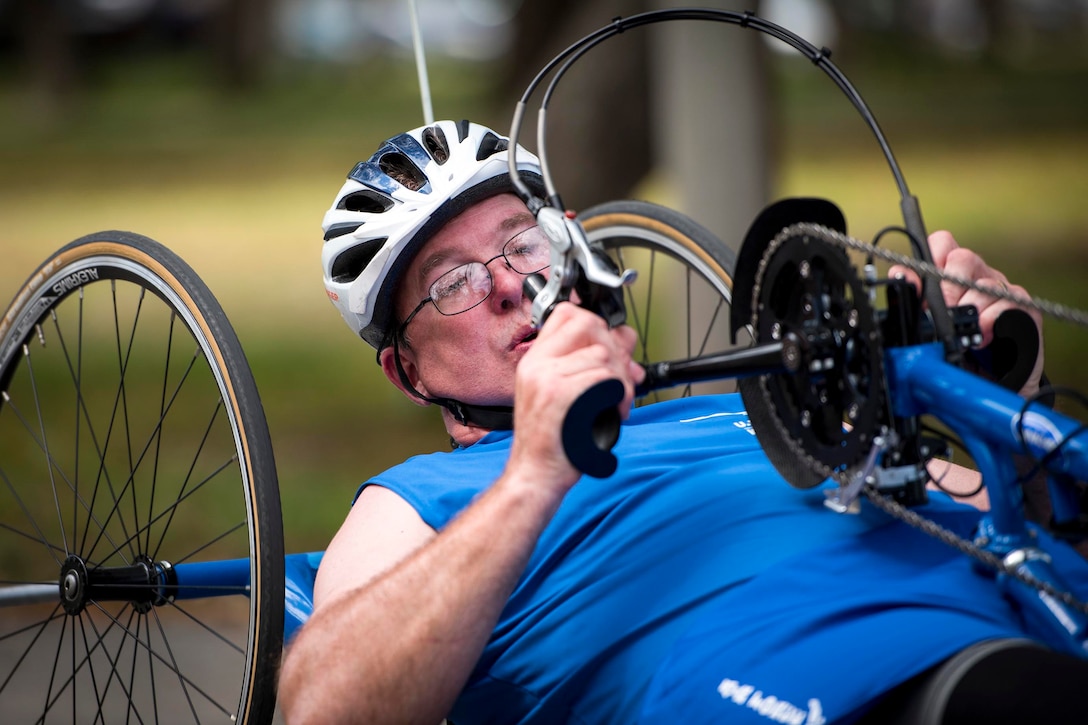 Chris Rust, an Air Force Warrior Games team member, prepares to take a turn on a recumbent bike during a cycling session at the team’s training camp at Eglin Air Force Base, Fla., April 26, 2017. Air Force photo by Samuel King Jr.