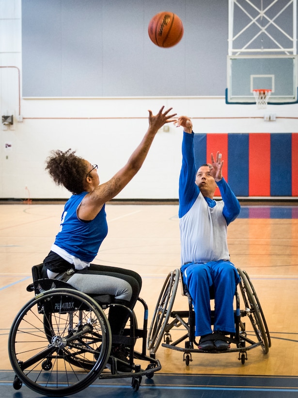 Jaquari Lopez reaches to block Israel Delgado Jr. during a Warrior CARE adaptive sports camp at Eglin Air Force Base, Fla., April 26, 2017. Air Force photo by Samuel King Jr.