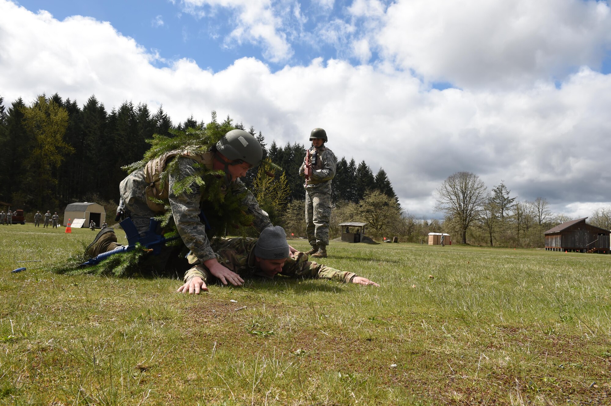 627th Civil Engineer Squadron Airmen use their air base defense training during their internal Capstone exercise April 20, 2017 at Joint Base Lewis-McChord, Wash. In the scenario several unidentified and hostile foreigners attempted to gain access to the base. (U.S. Air Force photo/ Staff Sgt. Naomi Shipley)