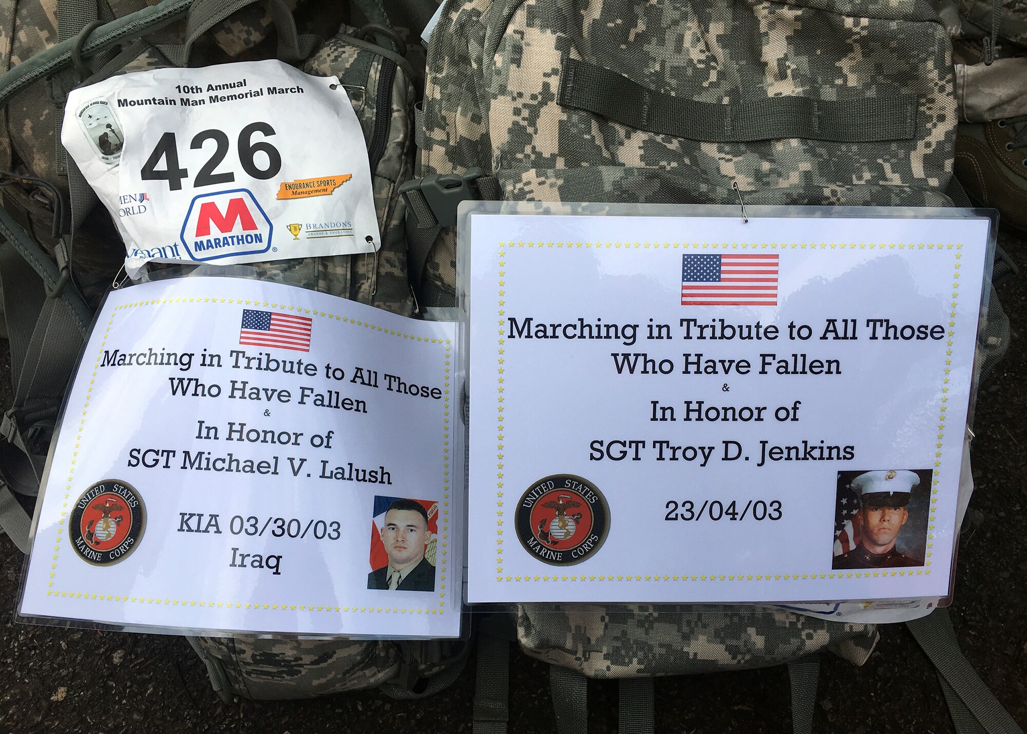 Placards with the names and photos of service members killed in action are pinned to entrants’ gear for the Mountain Man Memorial March April 22 in Gatlinburg, Tenn. The annual 26.2, 13.1 and 10K run/march/ruck has since grown to be among the largest Gold Star Family events east of the Mississippi. (U.S Air National Guard photo courtesy Chief Master Sergeant Paul H. Lankford EPME Center)