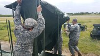 Soldiers assigned to the 597th Quartermaster Company (Laundry and Bath) assemble shower sets during the Tropical Journey exercise held at the Rafael Hernandez Airport in Aguadilla, April 23rd. Tropical Journey (TJ) is a full-scale VA driven “All Hazard Preparedness Response” exercise that began in 2005 and occurs every three years. The TJ17 scenario enables participants to assess objectives and core capabilities. This full-scale exercise provides a platform for 1st Mission Support Command unit leadership to evaluate METL collective training tasks within a DSCA operational environment.