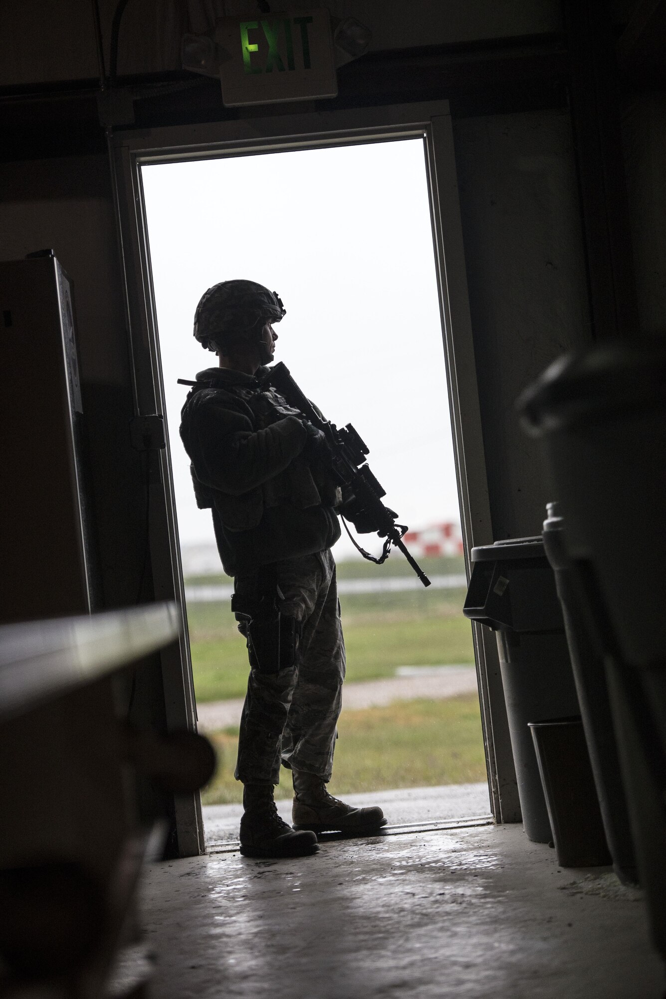 A 75th Security Forces Squadron Airman stands guard at the west entrance to building 732 during an active shooter and explosives response exercise at Hill Air Force Base, April 24. (U.S. Air Force/Paul Holcomb)