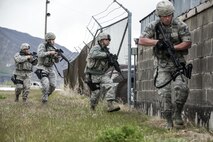 From the right, Staff Sgt. Jacob Sime, Staff Sgt. Richard Leslie, Senior Airman Dwight Gomes and Staff Sgt. Jason Lyons, all 75th Security Forces Squadron, respond to a report of an active shooter and explosives during a response exercise at building 732, Hill Air Force Base, April 24. (U.S. Air Force/Paul Holcomb)