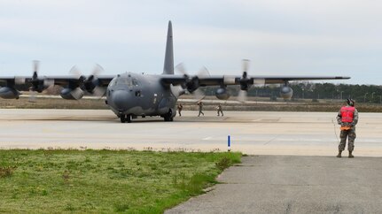 Members of the 106th Rescue Wing assigned to New York Air National Guard, run to add additional supplies for a rescue mission to Lajes, Azores, April 24, 2017, Westhampton Beach, N.Y.  The mission is to locate the aircraft and drop pararescuemen who will board the ship and provide emergency medical care to the crew. 