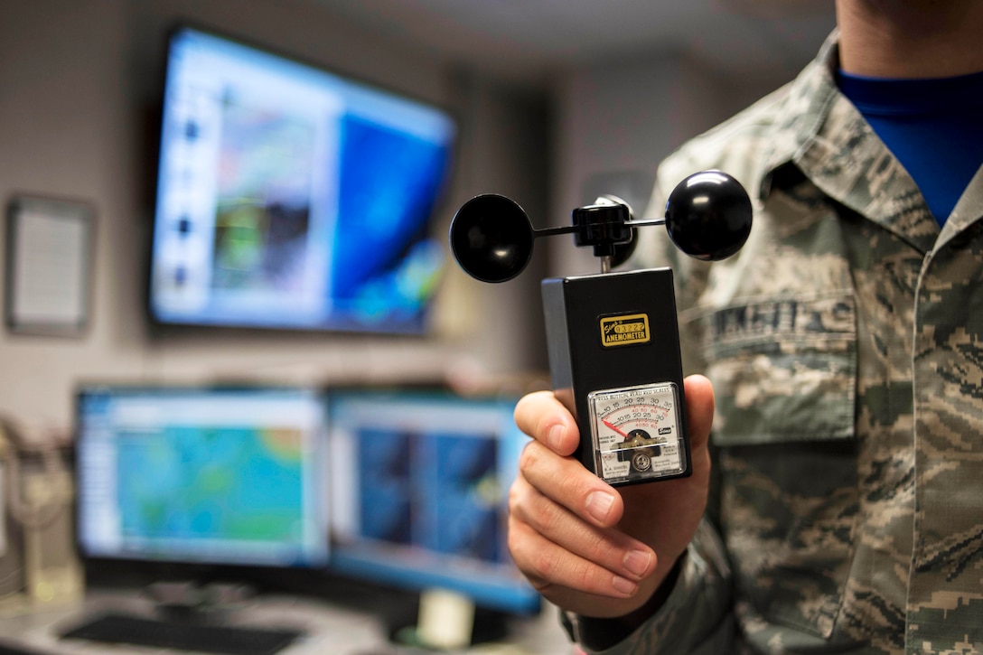 Air Force Airman 1st Class Joshua Tuckett holds an anemometer at Kadena Air Base, Japan, April 21, 2017. Manual devices such as the anemometer were used to measure wind speeds, but have since been replaced by automated systems that can provide instant data to forecasters. Air Force photo by Senior Airman John Linzmeier