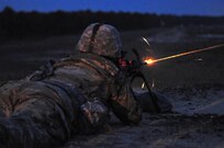 A U.S. Army Reserve Soldier engages a target with a Squad Automatic Weapon (SAW) during the Combined Best Warrior Competition SAW Night Qualification on Joint Base McGuire-Dix-Lakehurst, N.J. April 26, 2017. Contestants hopefully take the title of Best Noncommissioned Officer and Best Soldier and move on to represent the 412th Theater Engineer Command,  416th Theater Engineer Command and 76th Division (Operational Response) at the USARC Best Warrior Competition. (U.S. Army Reserve Photo by Sgt. 1st Class Clinton Wood)