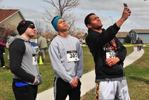 Participants take a “selfie” before the Minot Meltdown color run at Minot Air Force Base, N.D., April 25, 2017. The run was hosted by the Health and Wellness Center, Alcohol and Drug Abuse Prevention, Family Advocacy Program and Sexual Assault Prevention and Response Program. (U.S. Air Force photo/Senior Airman Apryl Hall)