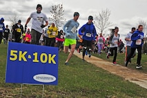 Runners take off during the Minot Meltdown color run at Minot Air Force Base, N.D., April 25, 2017. The purpose of the run was to raise awareness for alcohol abuse, child abuse and sexual assault. (U.S. Air Force photo/Senior Airman Apryl Hall)