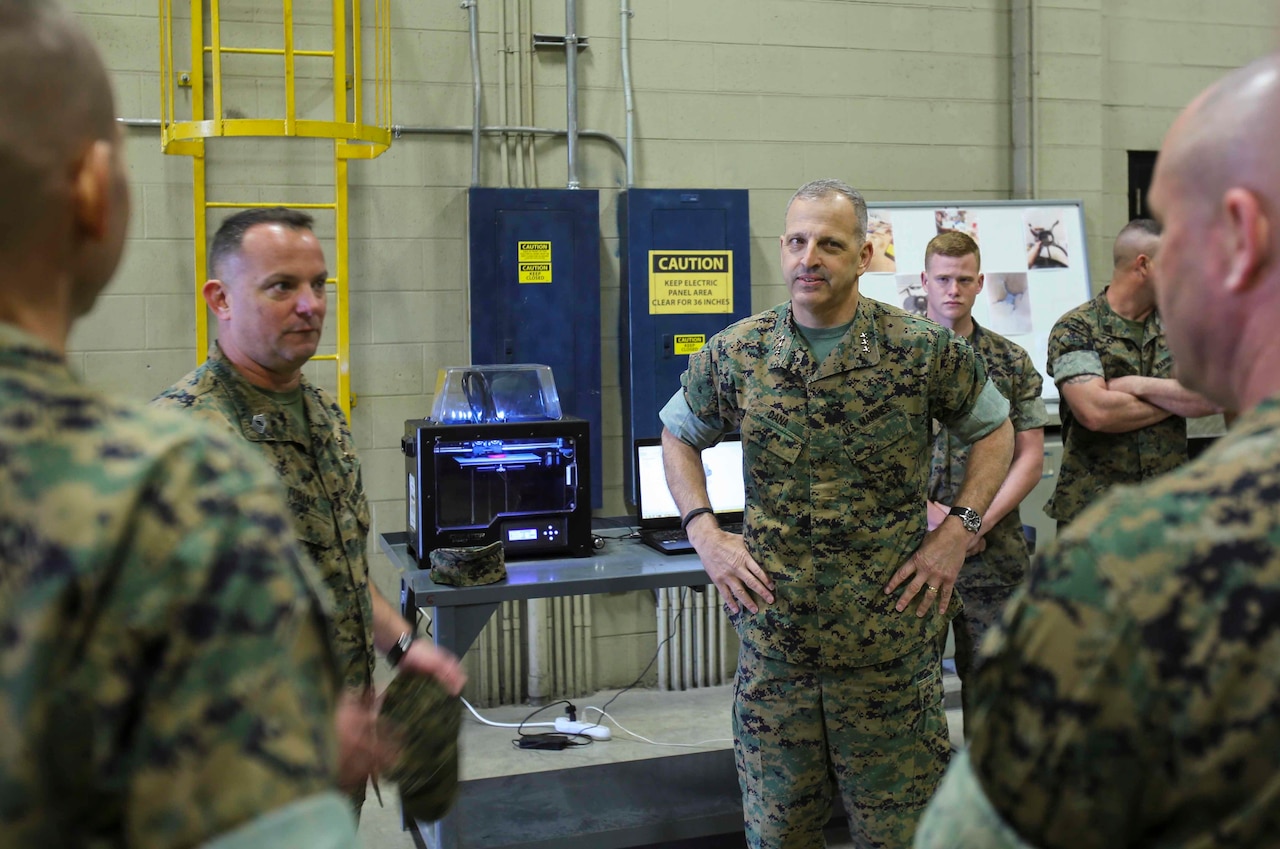 Lieutenant Gen. Michael Dana watches a demonstration of Combat Logistics Regiment 25’s 3D printer during a visit to Camp Lejeune, N.C., March 13, 2017. The 3D printer is able to make replicas of equipment that is mission critical. Dana is the Deputy Commandant of Installation and Logistics. (U.S. Marine Corps photo by Cpl. Ashley Lawson)