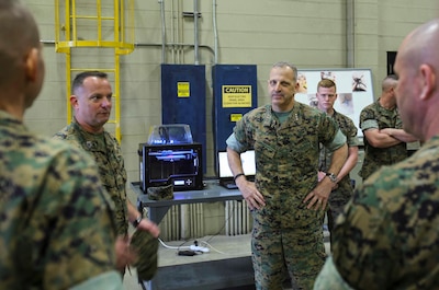 Lieutenant Gen. Michael Dana watches a demonstration of Combat Logistics Regiment 25’s 3D printer during a visit to Camp Lejeune, N.C., March 13, 2017. The 3D printer is able to make replicas of equipment that is mission critical. Dana is the Deputy Commandant of Installation and Logistics. (U.S. Marine Corps photo by Cpl. Ashley Lawson)