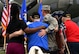 Retired Tech. Sgt. John Carpenter, Eighth Air Force World War II veteran, center, stands during the singing of the national anthem during a Mighty Eighth Heritage 8K held at Barksdale Air Force Base, La., April 26, 2017. Approximately 100 Airmen and their family members ran in honor of Eighth Air Force veterans as a way of recognizing and remembering the services and sacrifices they made for their country. The run served as one of the many events held in commemoration of the Eighth Air Force’s 75th anniversary. (U.S. Air Force photo by Senior Airman Erin Trower) 