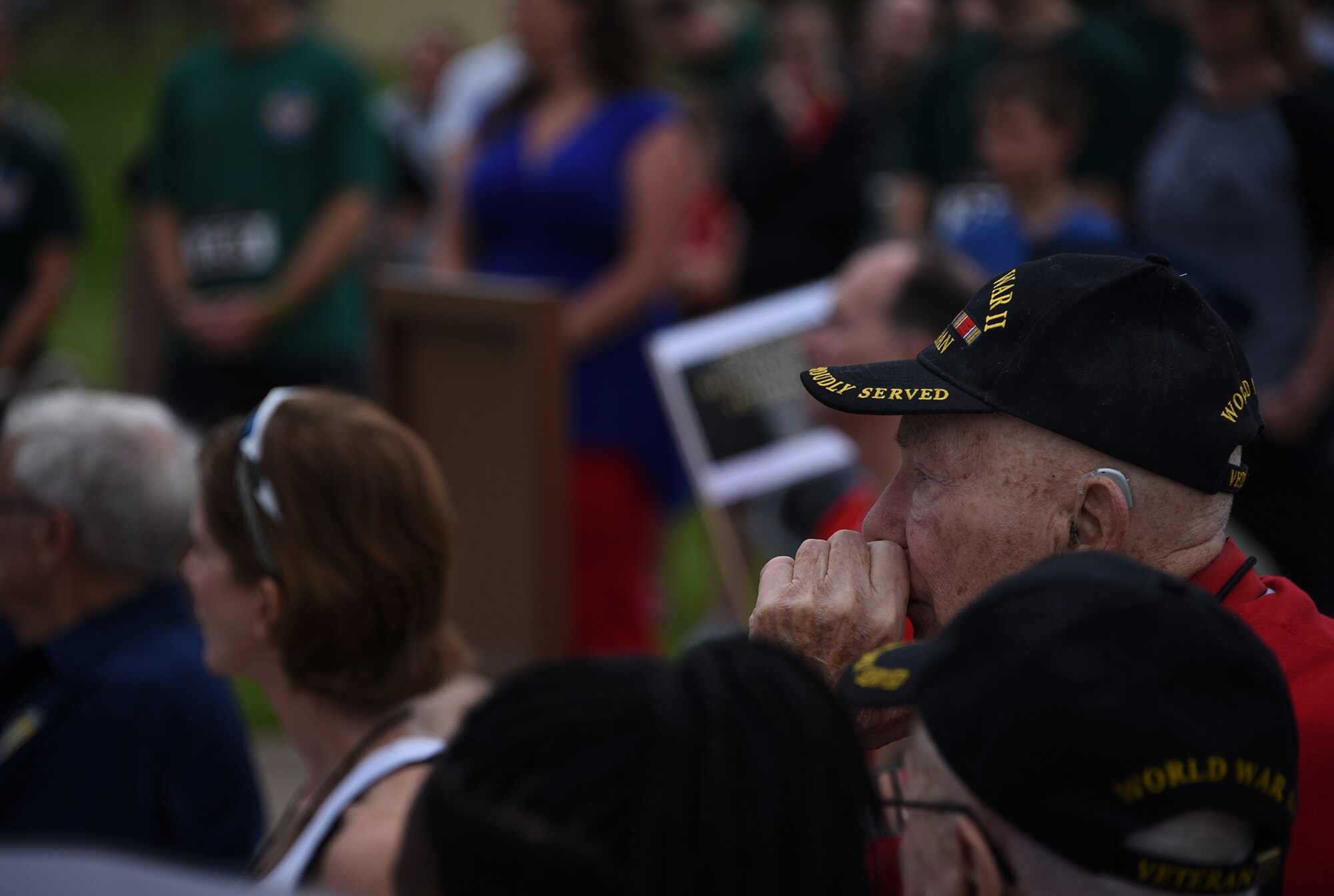 Retired Col. Steven dePyssler, Eighth Air Force World War II veteran, listens to remarks during the Mighty Eighth Heritage 8K event’s opening ceremony at Barksdale Air Force Base, La., April 26, 2017. Approximately 100 Airmen and their family members ran in honor of Eighth Air Force veterans as a way of recognizing and remembering the services and sacrifices they made for their country. The run served as one of the many events held in commemoration of the Eighth Air Force’s 75th anniversary. (U.S. Air Force photo by Senior Airman Erin Trower) 
