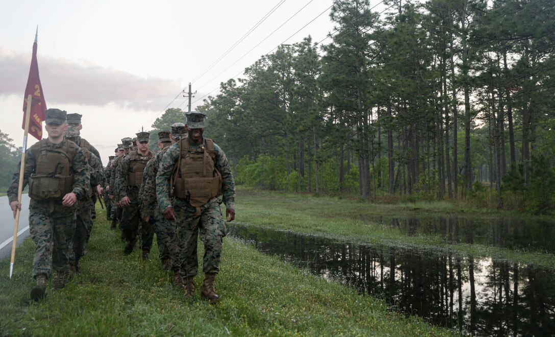 Major Aniema Utuk leads the way on a six mile hike on Camp Lejeune, N.C., April 27, 2017. The hike is essential for preparing Marines and Sailors for future combat missions and promotes unit cohesion. The Marines belong with the II Marine Expeditionary Force Headquarters group. (Photo by Lance Cpl. Leynard Kyle Plazo)