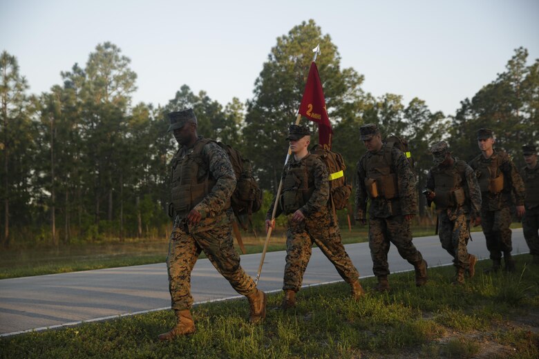 Major Aniema Utuk leads the way on a six mile hike at Camp Lejeune, N.C., April 27, 2017. The hike is essential for preparing Marines and Sailors for future combat missions and promotes unit cohesion. The Marines belong with II Marine Expeditionary Force Headquarters group. (Photo by Lance Cpl. Leynard Kyle Plazo)