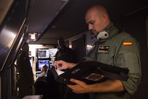 Staff Sgt. Francisco, a Spanish air force student sensor operator, reviews MQ-9 Reaper procedures before a flight at Holloman Air Force Base, NM on April 19, 2017. Spain is currently participating in essential training here at the MQ-9 formal training unit. (U.S. Air Force photo by Tech. Sgt. Amanda Junk)