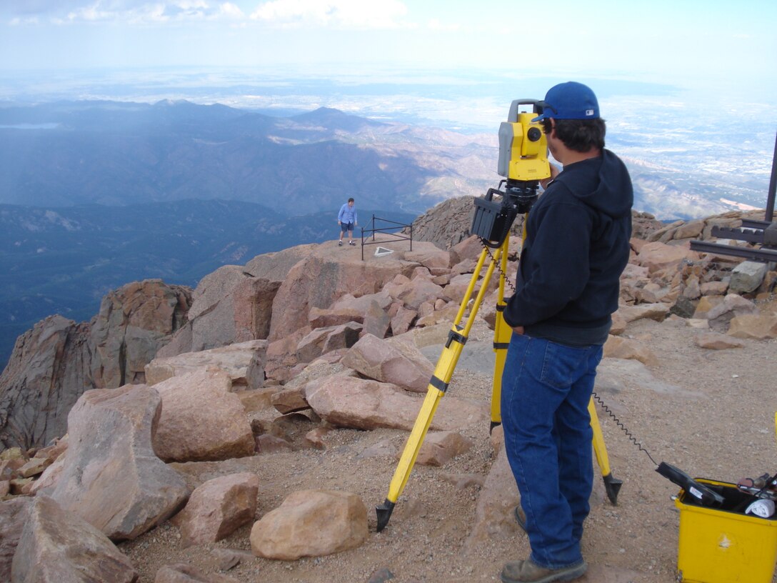 Field surveyor Ryan King performs topographic a survey for renovation project at the Pikes Peak Visitor Center.