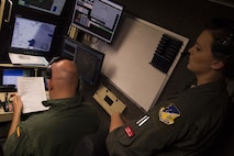 Staff Sgt. Megan, a 29th Attack Squadron sensor operator instructor, reviews operation procedures for the MQ-9 Reaper with Staff Sgt. Francisco, a Spanish air force student sensor operator, at Holloman Air Force Base, NM on April 19, 2017. Spain is currently participating in essential training here at the MQ-9 formal training unit. (U.S. Air Force photo by Tech. Sgt. Amanda Junk)