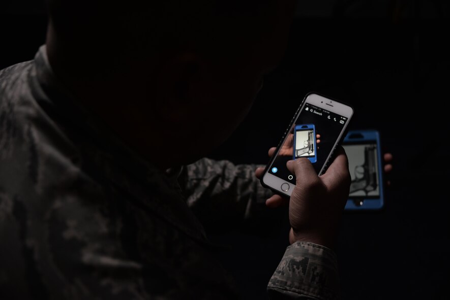 An Airman with the 301st Intelligence Squadron, Joint Base Elmendorf-Richardson, Alaska, may have averted a tragedy with his quick thinking, creative use of technology and drive to do the right thing. An Airman 1st Class, administrative apprentice, alerted the appropriate officials when he received a text message from his sibling regarding an alarming social media video. The video showed a Hallandale Beach High School, Miami, Florida, student wielding a handgun with a loaded magazine during a pep rally.  A Code Red was immediately initiated and the school was locked down. (U.S. Air Force photo/Staff Sgt. Alexandre Montes) 
