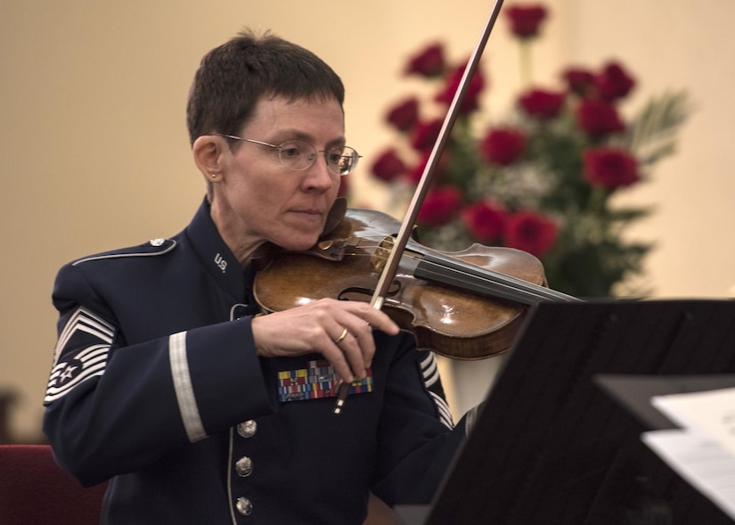 Chief Master Sgt. Deborah R. Volker, U.S. Air Force Band Strings flight chief and violinist, performs during the Holocaust Commemoration at Joint Base Andrews, Md., April 26, 2017. The memorial featured an invocation, prayers and a speech made by Dr. Alfred Münzer, Holocaust survivor. (U.S. Air Force photo by Senior Airman Jordyn Fetter)