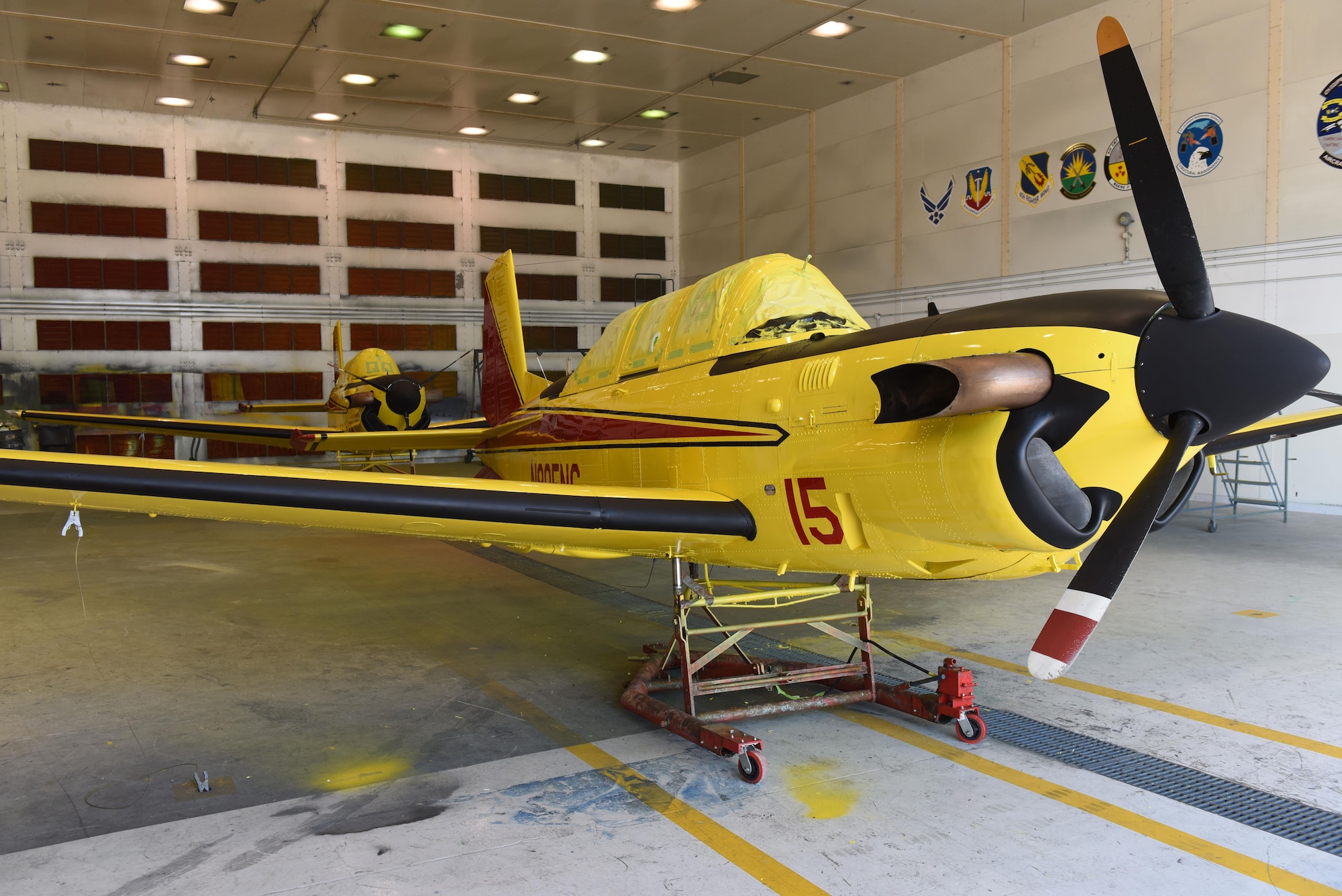 Freshly painted North Carolina Forest Service aviation division T-34C Turbo Mentors sit in the 4th Equipment Maintenance Squadron corrosion control shop, April 21, 2017, at Seymour Johnson Air Force Base, North Carolina. The two turbine powered T-34Cs replaced the piston powered T-34B Mentor lead aircraft previously used by the NCFS. (U.S. Air Force photo by Airman 1st Class Ashley Williamson)
