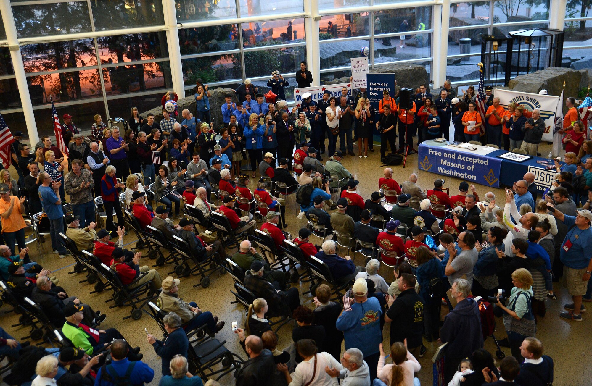 Veterans participating in the Puget Sound Honor Flight are welcomed home by members of the local community April 24, 2017, at Seattle-Tacoma International Airport Seattle, Wash. More than 20 Puget Sound Airmen volunteered to provide escort to the veterans. (U.S. Air Force photo/Senior Airman Jacob Jimenez)   